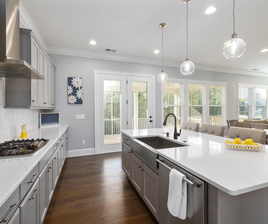 A kitchen featuring Cabinets painted grey with an kitchen island.